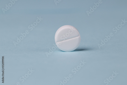 pills background, tablets on a blue background