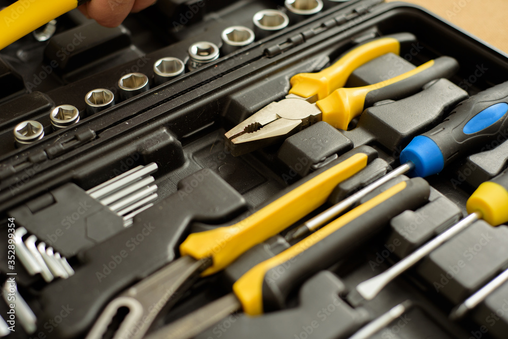 a tool kit in a suitcase to repair something. a tool kit in a suitcase to repair something.