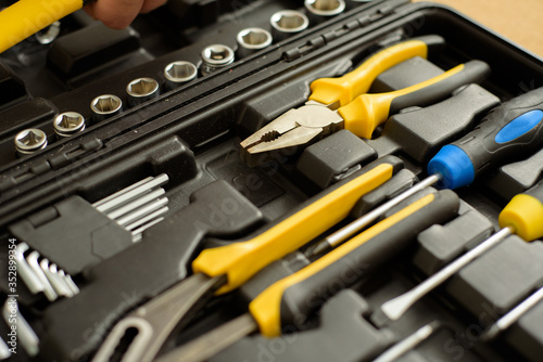 a tool kit in a suitcase to repair something.
