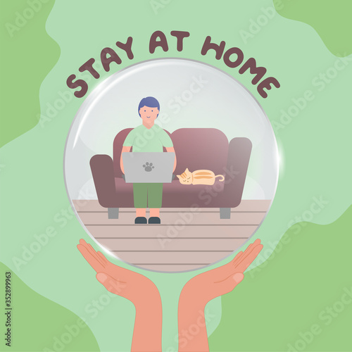 Working from home during COVID-19 concept, man using laptop on sofa and cat sleep on sofa in glass globe