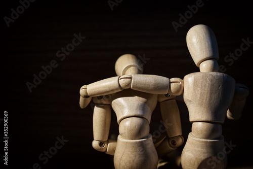 Wooden mannequin, Concern and worry of friend. Mental health, PTSD and suicide prevention. Post-traumatic stress disorder.