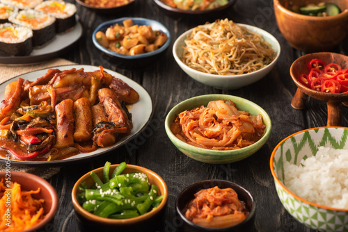 selective focus of traditional and tasty korean dishes on wooden surface