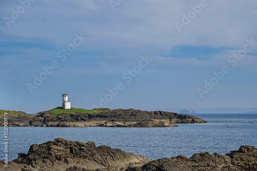 Small lighthouse on the seashore