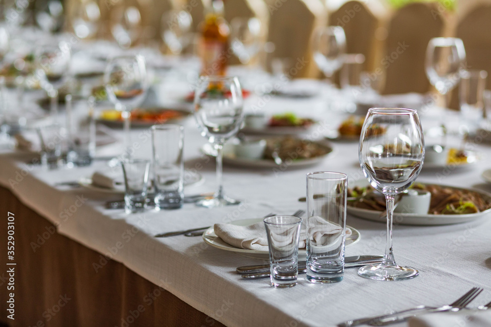 Glasses on table served for dinner in cozy restaurant