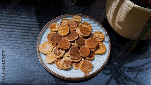 Traditional Dutch Mini Pancakes without any other ingredients with the black background
