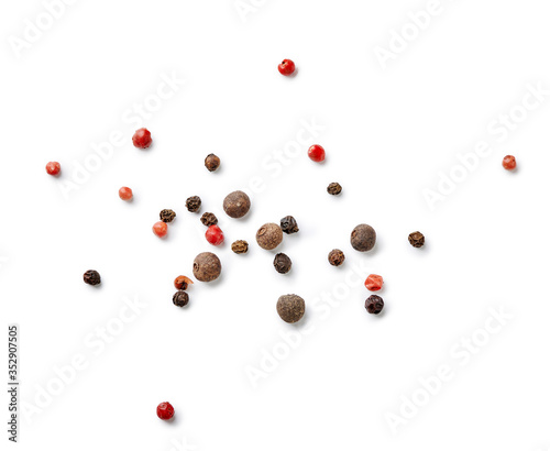Mix of black and red pepper, pimento isolated on white background. Top view of allspices and spices.