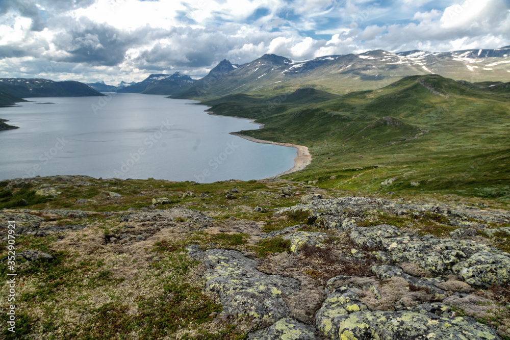 Summer scenery in Jotunheimen national park in Norway, mountains and lake