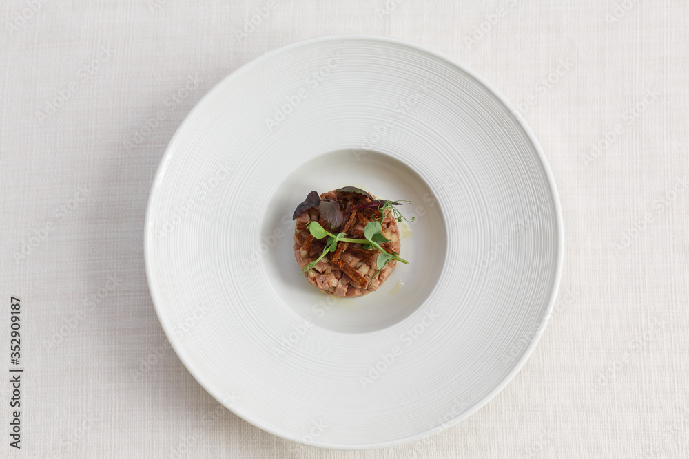 duck tartare on whitw plate white background duck tartare on whitw plate white background