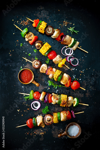 Chicken kebabs on skewers with mushrooms and vegetables