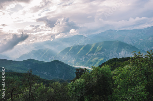 A picturesque wide landscape view of the hazy valley of Var in the Alps mountains  Col de Rigaudon  Alpes-Maritimes  France 