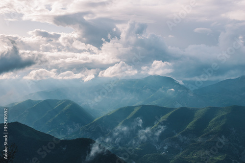 A picturesque wide landscape view of the hazy valley of Var in the Alps mountains (Col de Rigaudon, Alpes-Maritimes, France)