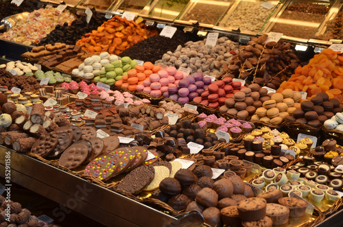 Sweet and chocolate stall in the food market in Barcelona, Spain, Mercado de La Boqueria.