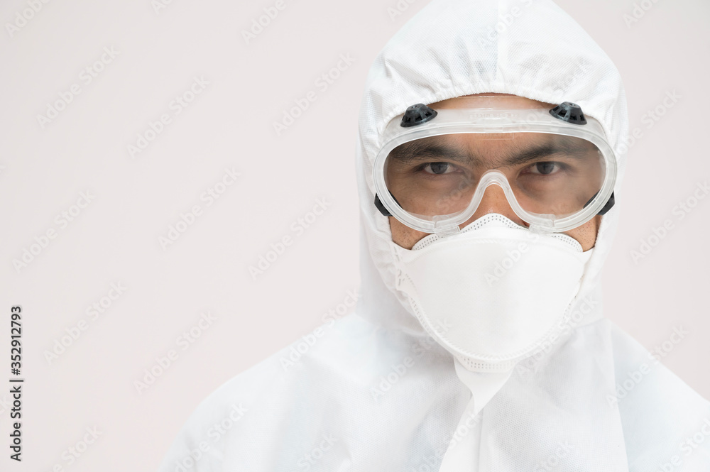Portrait Asian doctor in protective PPE suit wearing face mask and eyeglasses for protect coronavirus covid-19 virus.Scientist male wearing personal protection equipment making laboratory in hospital. Portrait Asian doctor in protective PPE suit wearing face mask and eyeglasses for protect coronavirus covid-19 virus.Scientist male wearing personal protection equipment making laboratory in hospital.