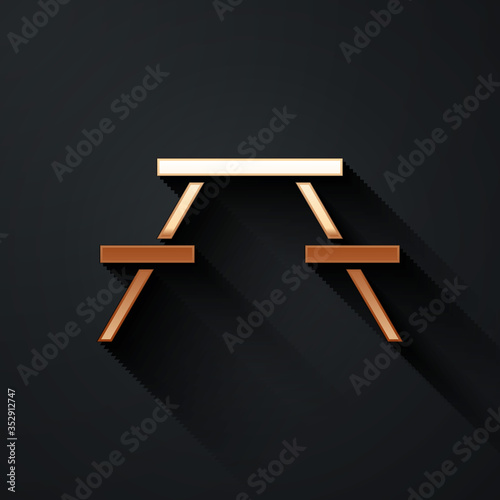 Gold Picnic table with benches on either side of the table icon isolated on black background. Long shadow style. Vector.