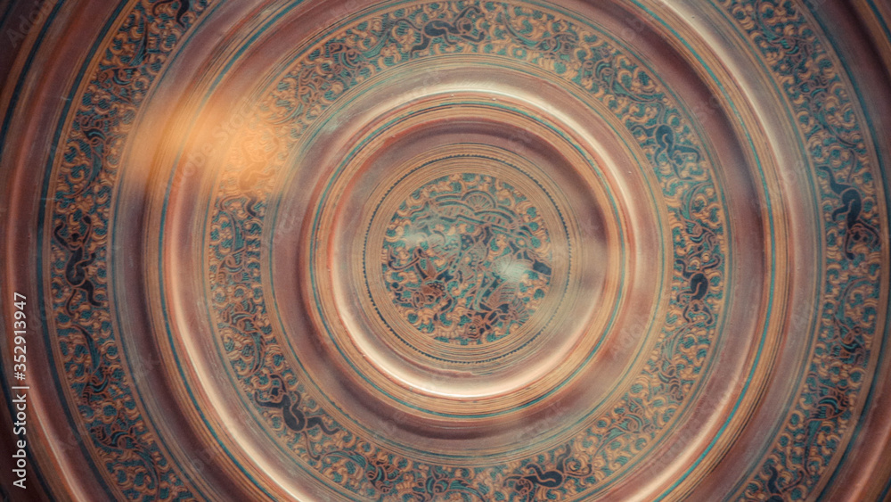 A close up of engraved clay through glass