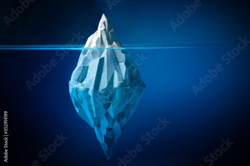 White iceberg on deep blue background. Environment concept. Winter concept. Ocean underwater background.