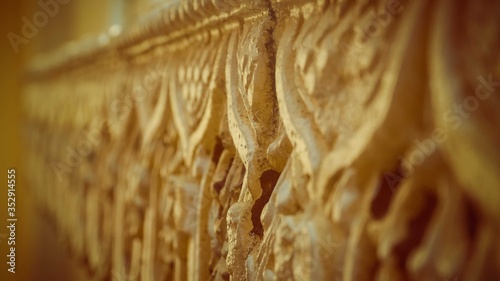 A close up of engraved yellow wall