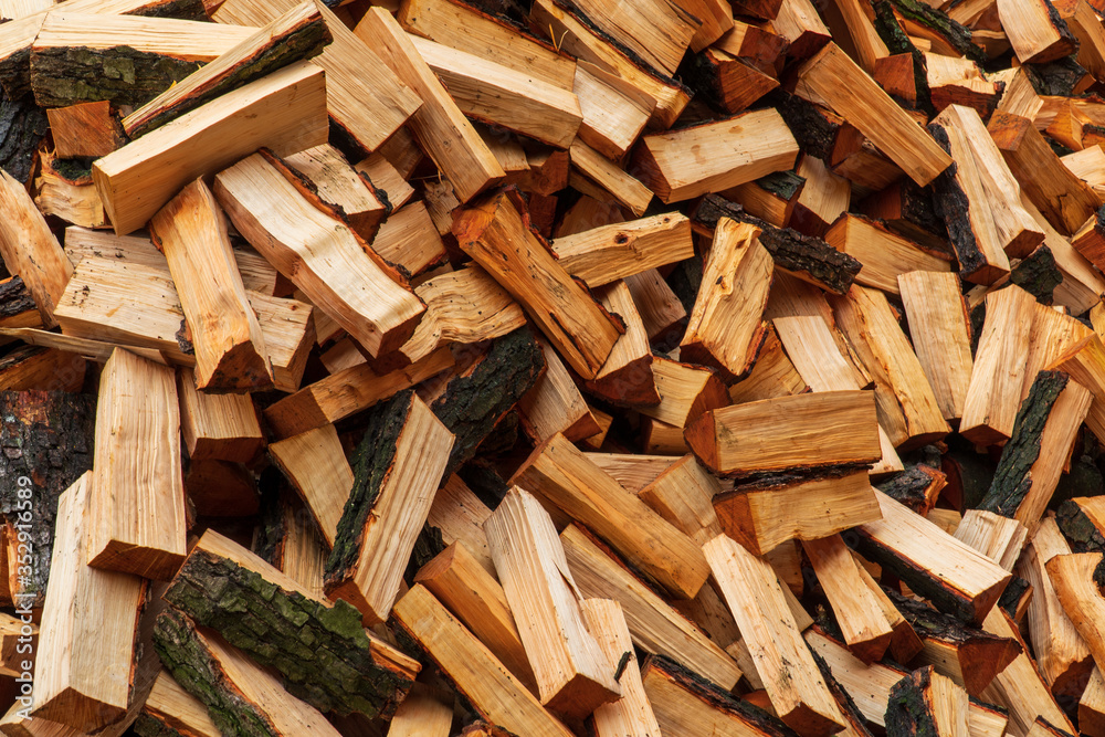 Stacked Chopped Alnus Firewood on Pile Stacked Chopped Alnus Firewood on Pile