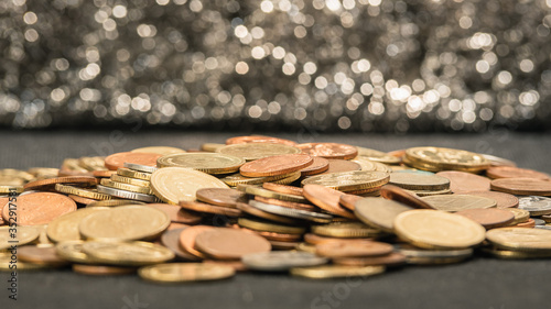A pile of gold coins, silver coins, bronze coins
