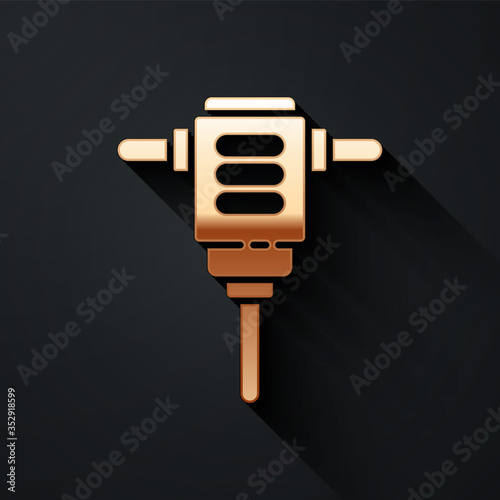 Gold Electric rotary hammer drill machine icon isolated on black background. Working tool for construction, finishing, repair work. Long shadow style. Vector.