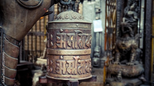 Close up of a bell with written words