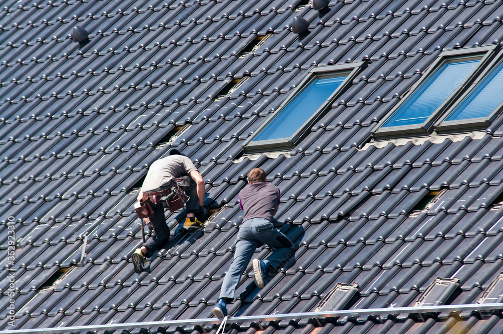 Installing solar panels on the roof of private house Installing solar panels on the roof of private house