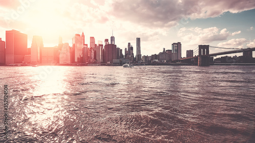 New York City skyline seen from Brooklyn at sunset, color toning applied, USA.
