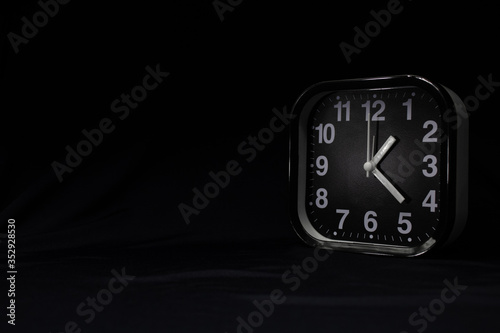 Alarm clock on a dark background