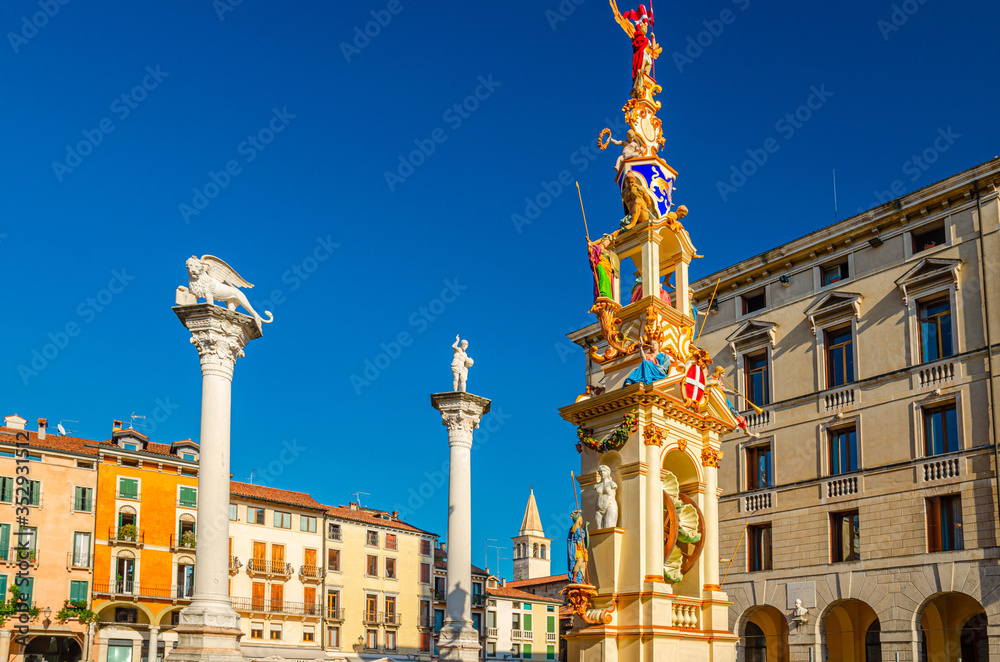 Columns with winged lion and statues in Piazza dei Signori square, old historical city centre of Vicenza city, Veneto region, Italy