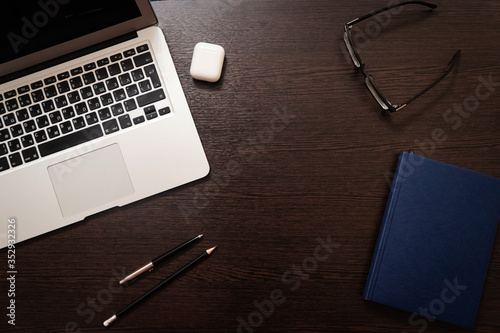 Notebook, pen, pencil and notebook on the table. Remote work.