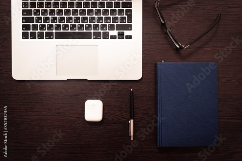 Notebook, pen, pencil and notebook on the table. Remote work.