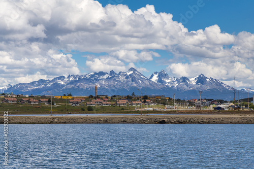Beautiful view on Ushuaia harbour with Chilean mountain range on the background, Tierra del Fuego province, Argentina © Alexander