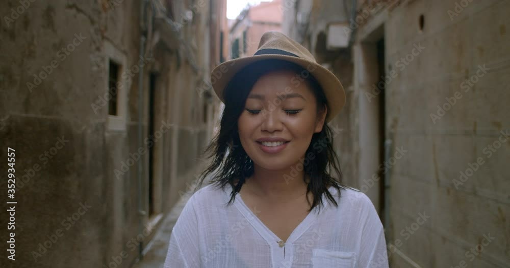 Portrait of pretty young woman wearing fedora travelling abroad in Venice Italy Portrait of pretty young woman wearing fedora travelling abroad in Venice Italy