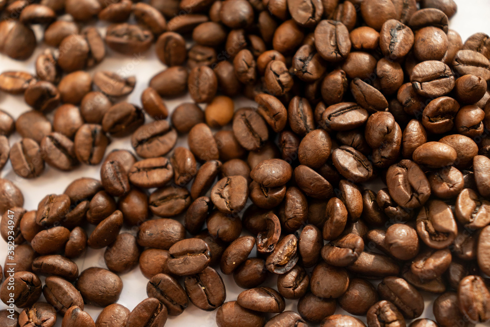 coffee beans a lot of coffee scattered on a white background