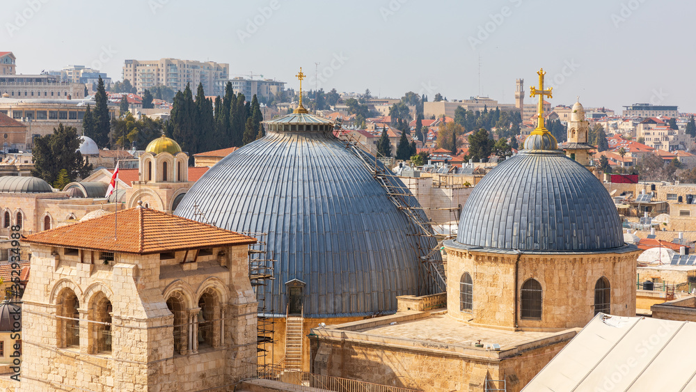 Obraz premium View from top on two domes and belfry of the Church of the Holy Sepulchre and Omar's mosque in Jerusalem