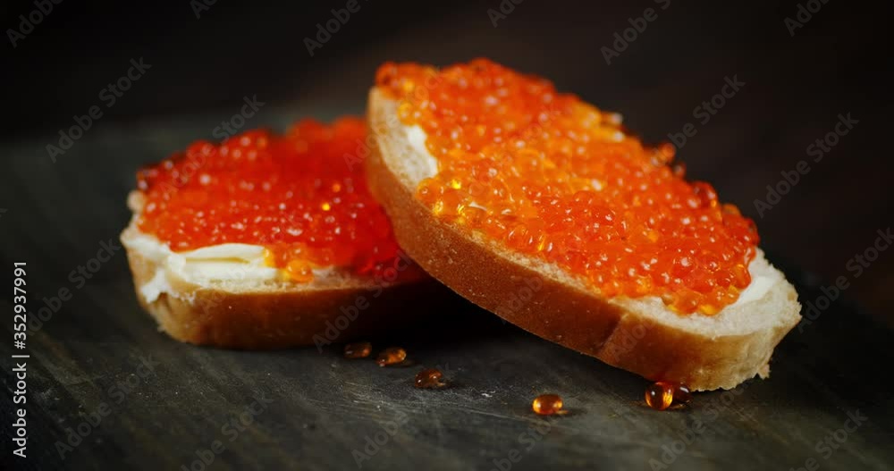 Sandwiches with red caviar grains rotate slowly. Sandwiches with red caviar grains rotate slowly.