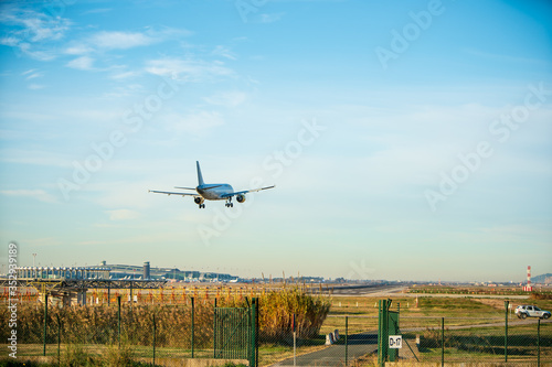BARCELONA, CATALUNYA, SPAIN - DECEMBER 13, 2017: Vueling company plane landing at El Prat airport, Barcelona.