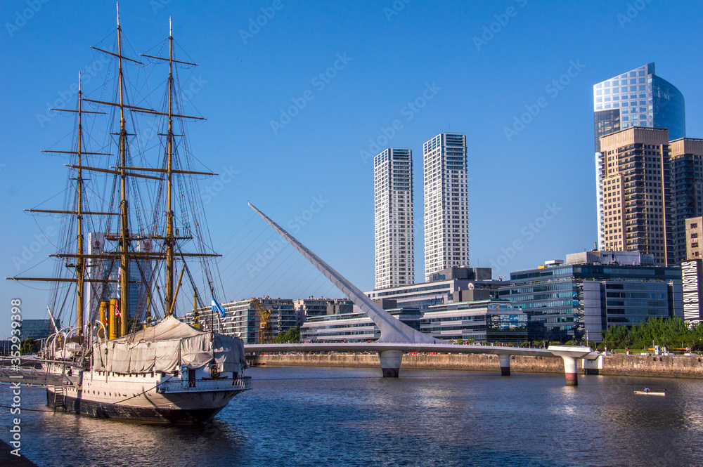 View of a old boat in a port of Buenos Aires near to the bridge Puente de la Mujer