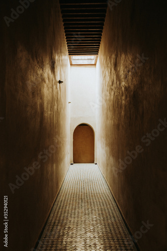 Temple door in tiled narrow allyway in Marrakesh Morocco