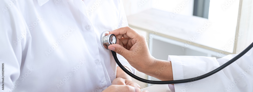 Doctor using a stethoscope checking patient with examining, presenting results symptom and recommend treatment method, Healthcare and medical concept