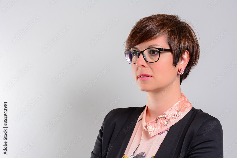 Portrait of a confident mid adult businesswoman working in a modern office Portrait of a confident mid adult businesswoman working in a modern office