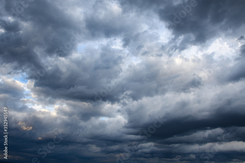 Stormy sky with storm clouns on the sunset with beautiful sun