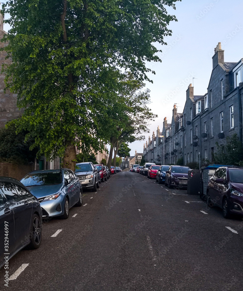 Aberdeen, Scotland/UK - May 21 2020: Empty streets during Coronavirus lockdown in Scotland with parked cars.