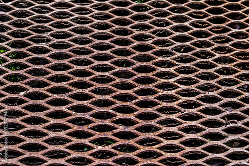 Rusty diamond mesh netting. Brown expanded metal stylish pattern