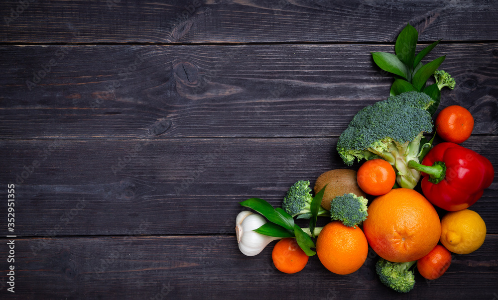 Vegetables and fruits to maintain immunity on a black background. Copy space Vegetables and fruits to maintain immunity on a black background. Copy space