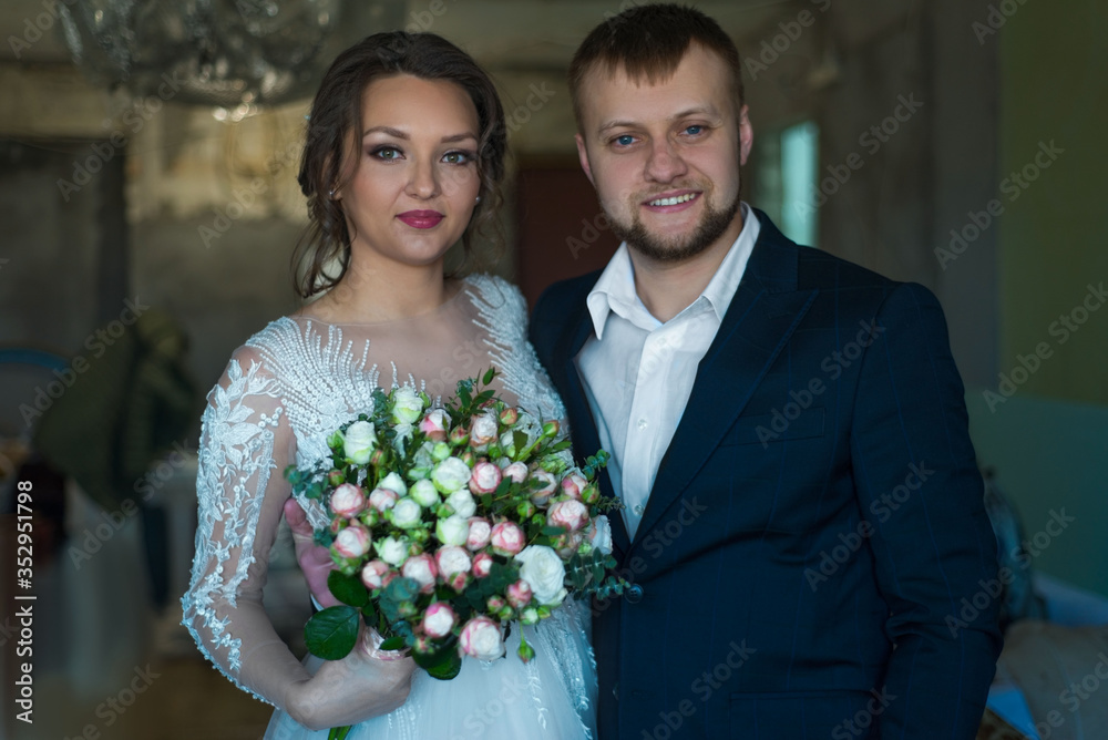 portrait of a happy bride and groom. Smiling young people of twenty-five years old, wedding ceremony, bride and groom couple in love, wedding dress, men's suit. portrait of a happy bride and groom. Smiling young people of twenty-five years old, wedding ceremony, bride and groom couple in love, wedding dress, men's suit.