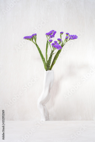 Fototapeta Naklejka Na Ścianę i Meble -  vase and flowers minimalist arranged