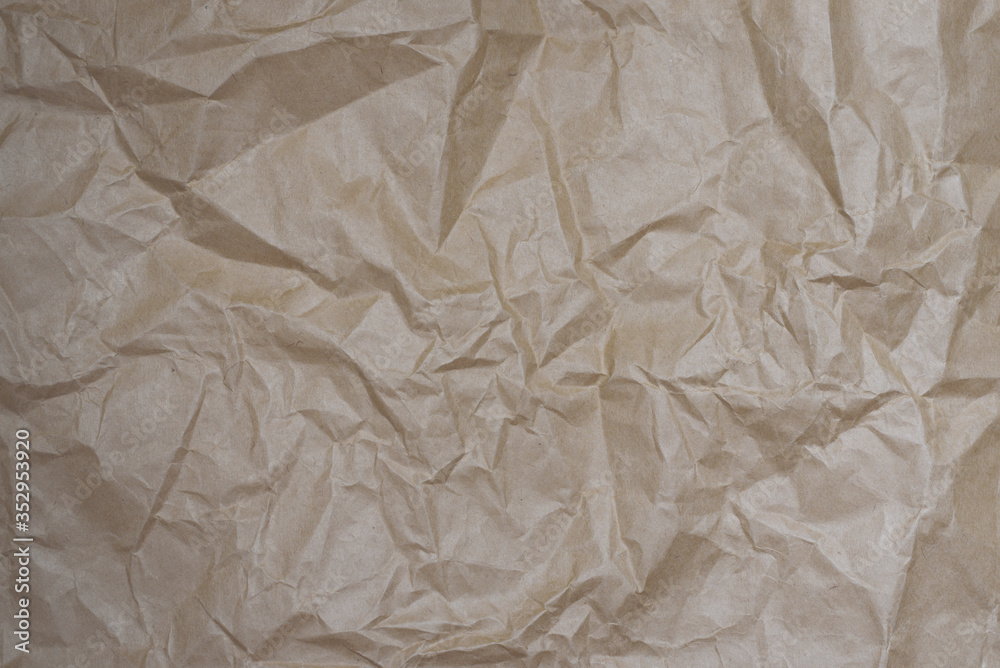 Obraz premium Close up craft crumpled beige paper for background usage. Cope space.