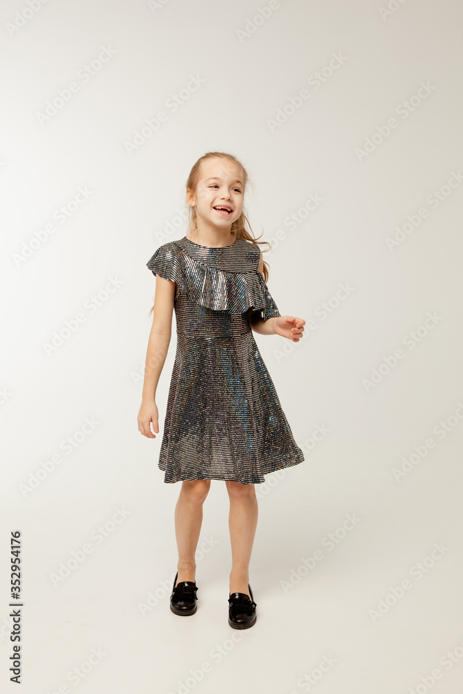 Little girl in sequin dress is dancing Little girl in sequin dress is dancing