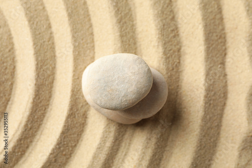 Stones on the sand with patterns. Zen concept